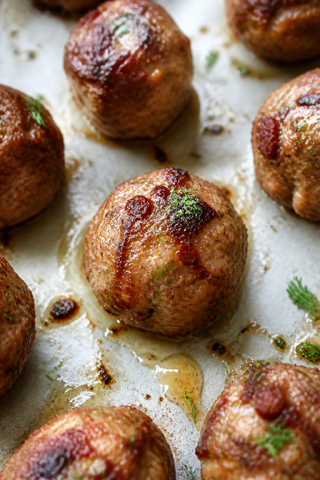 Close-up detail: A cluster of freshly baked keto turkey bacon ranch meatballs resting on a parchment