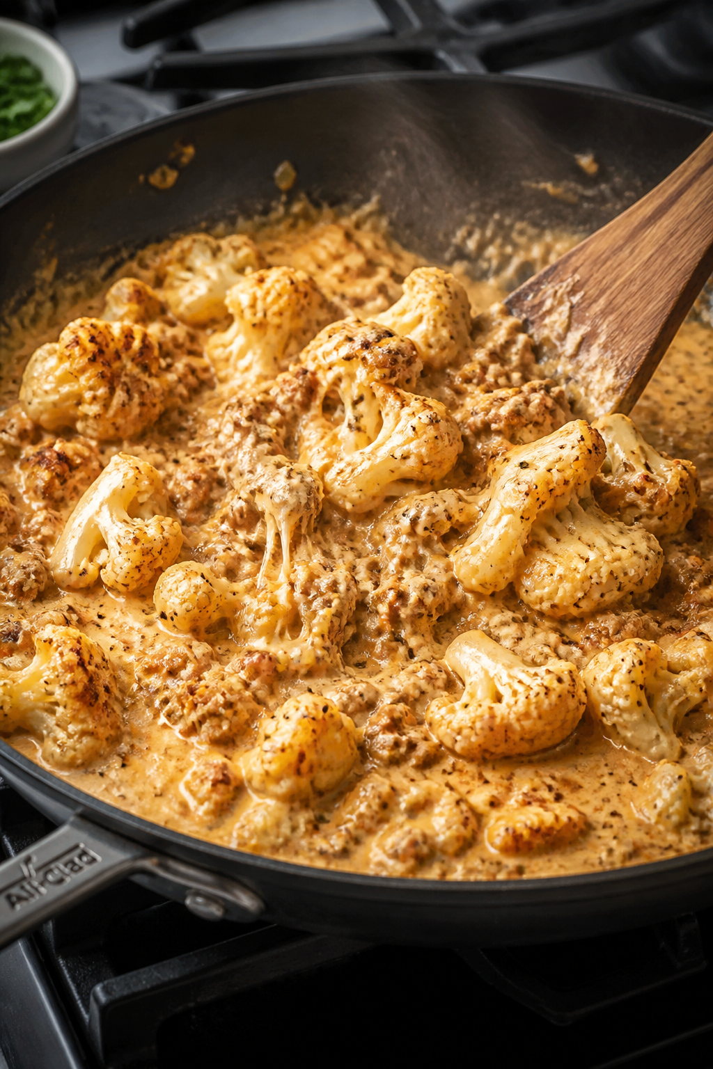 Cooking process, skillet action: Sautéed ground turkey with diced onions and garlic simmering in a 