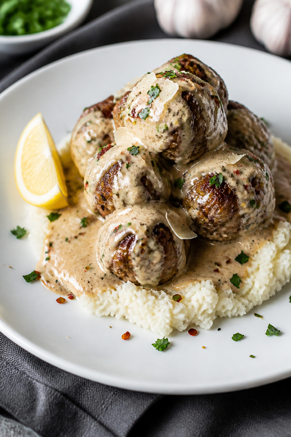 Final dish presentation: Restaurant-quality plating of Keto Meatballs with Roasted Garlic Sauce over