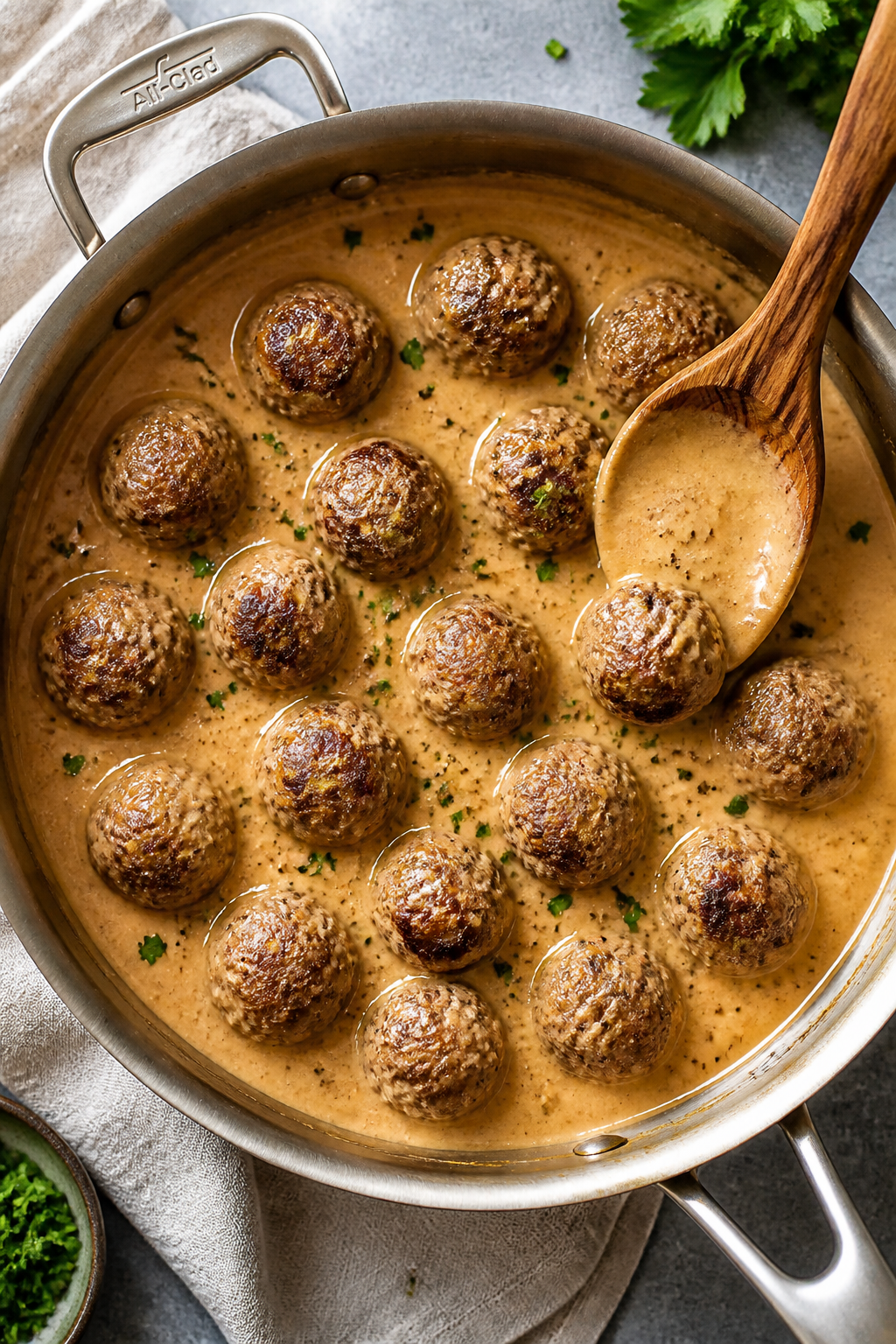 Tasty top view: Overhead shot of a family-style serving pan filled with Keto Swedish Meatballs nestl