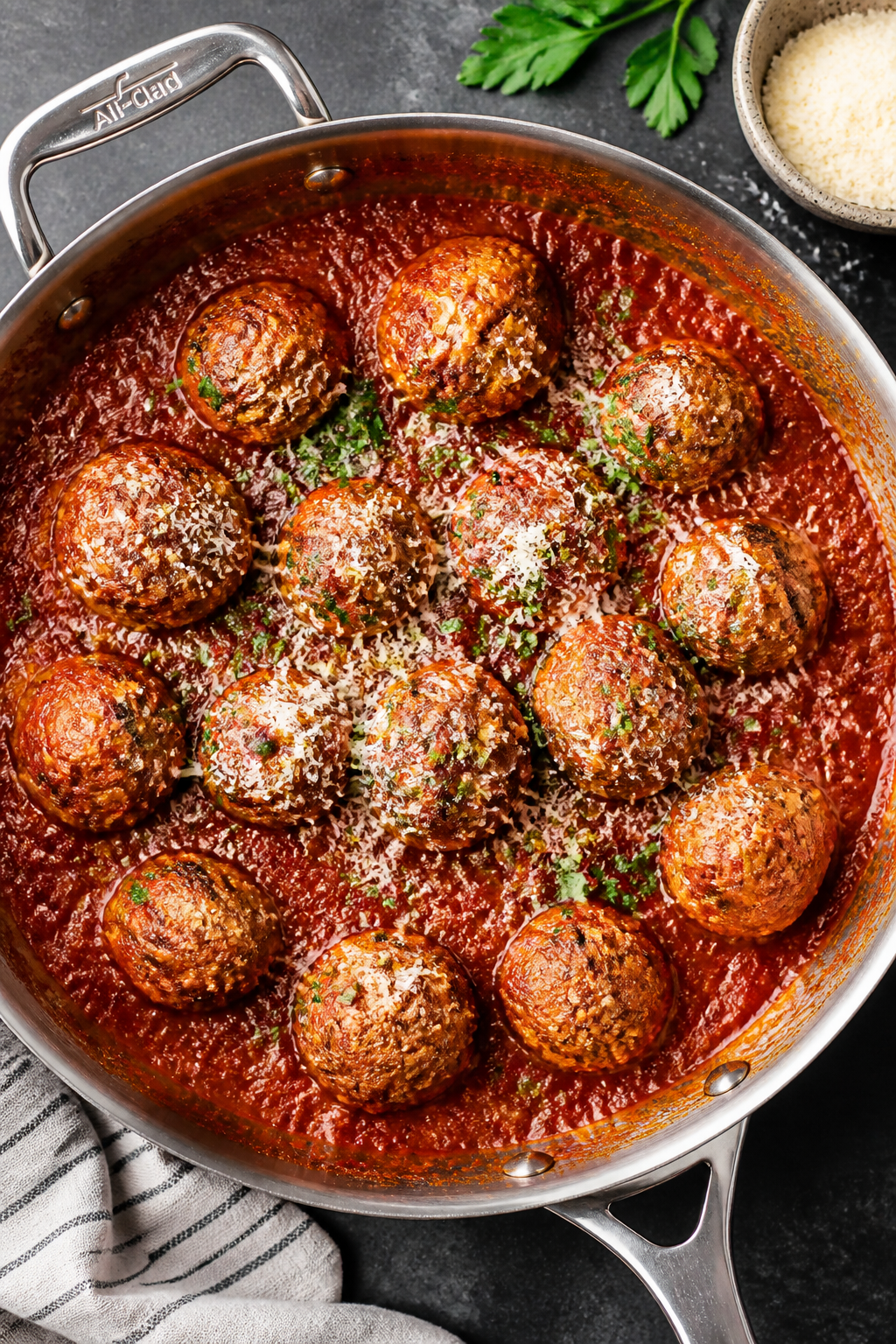 Tasty top view: Overhead shot of baked turkey meatballs gently simmering in low-sugar marinara, nest