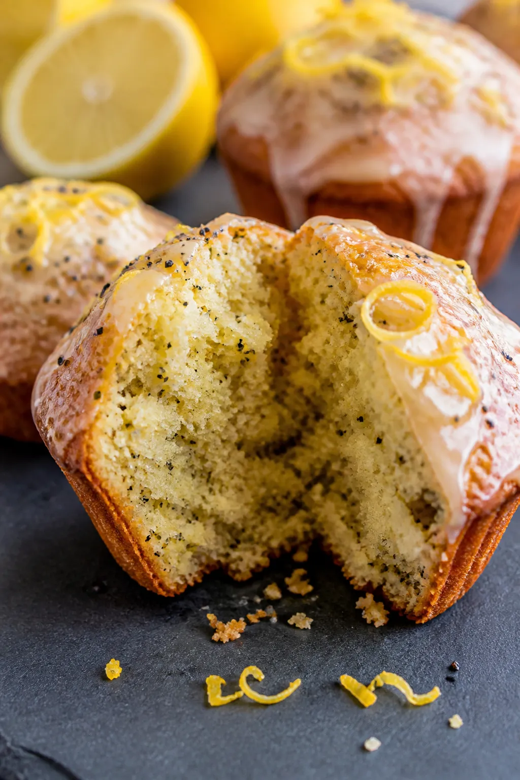 Close-up detail: Warm keto lemon poppy seed muffin torn open to reveal moist, tender almond-flour cr