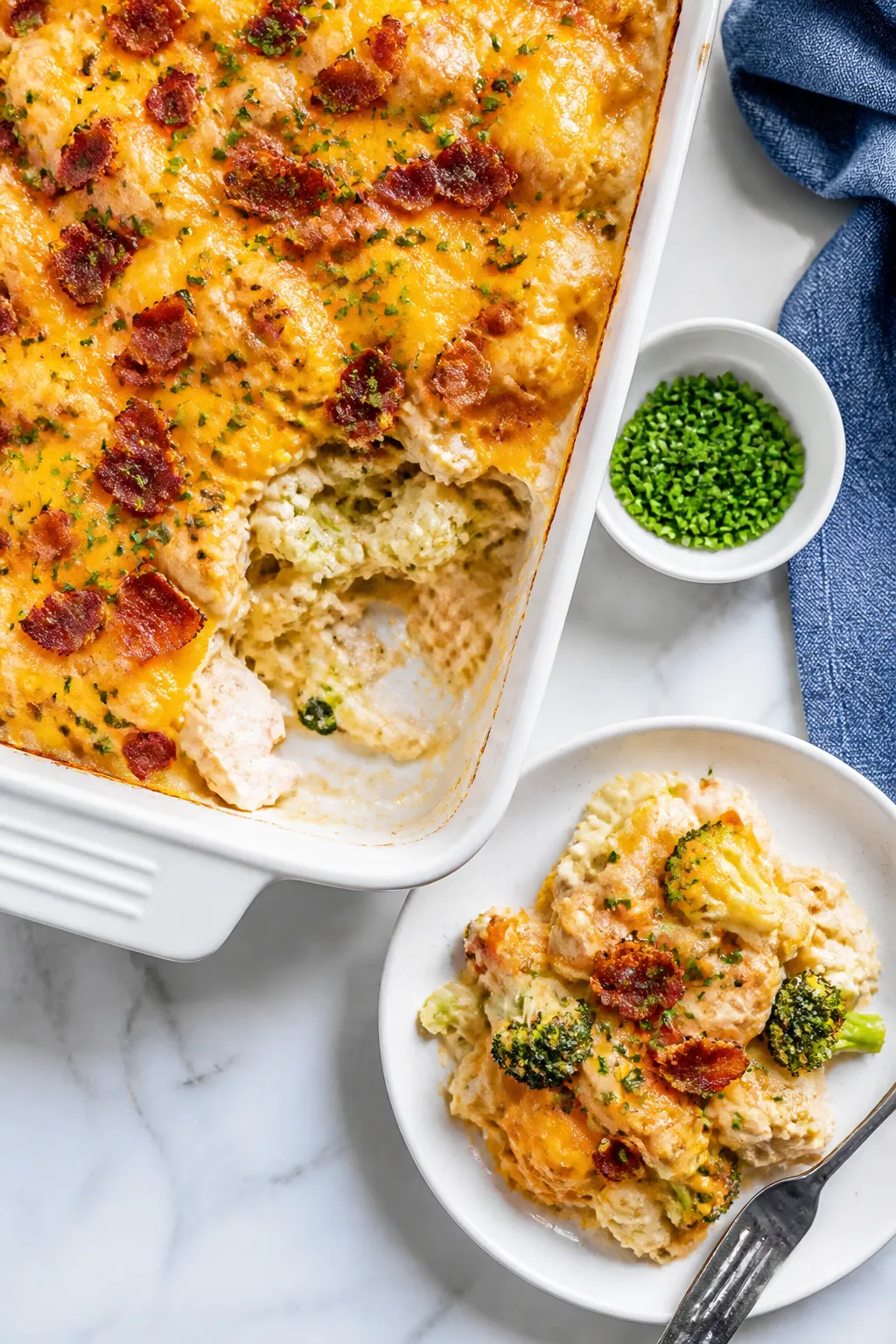 Tasty top view: Overhead shot of a 9x13 baked Keto Chicken Bacon Ranch Casserole in the dish with a 