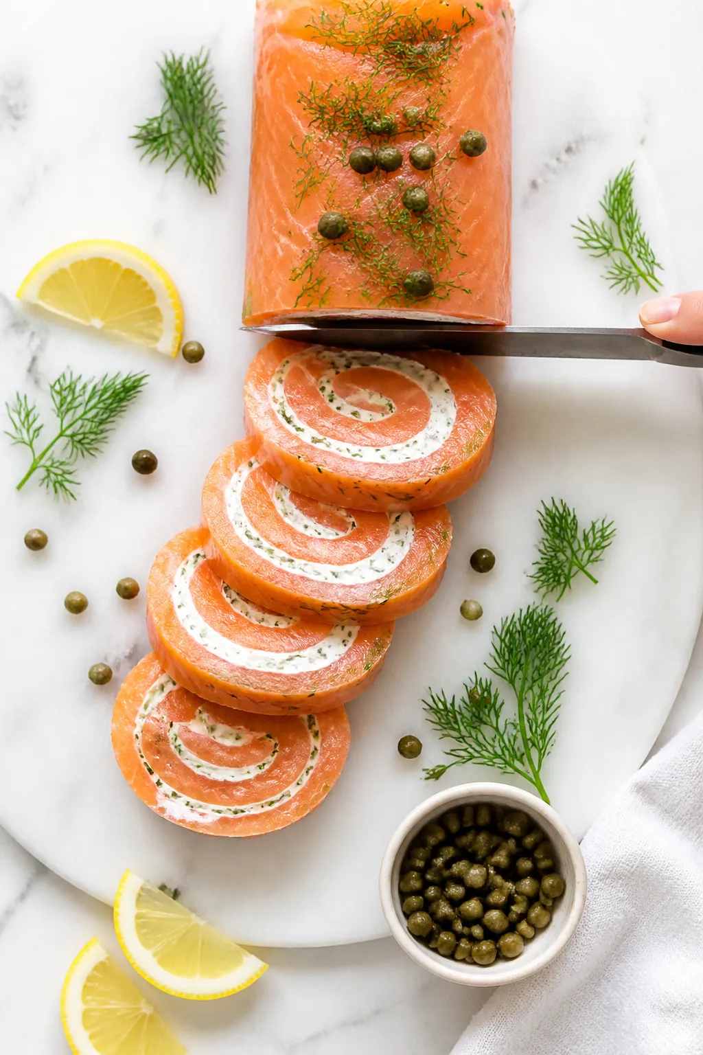 Tasty top view: Overhead shot of a chilled salmon roll-up log being sliced into 1–