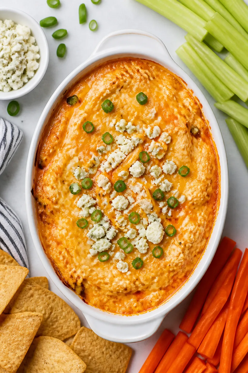 Tasty top view — Overhead shot of the finished Keto Buffalo Chicken Dip in a small white baking di